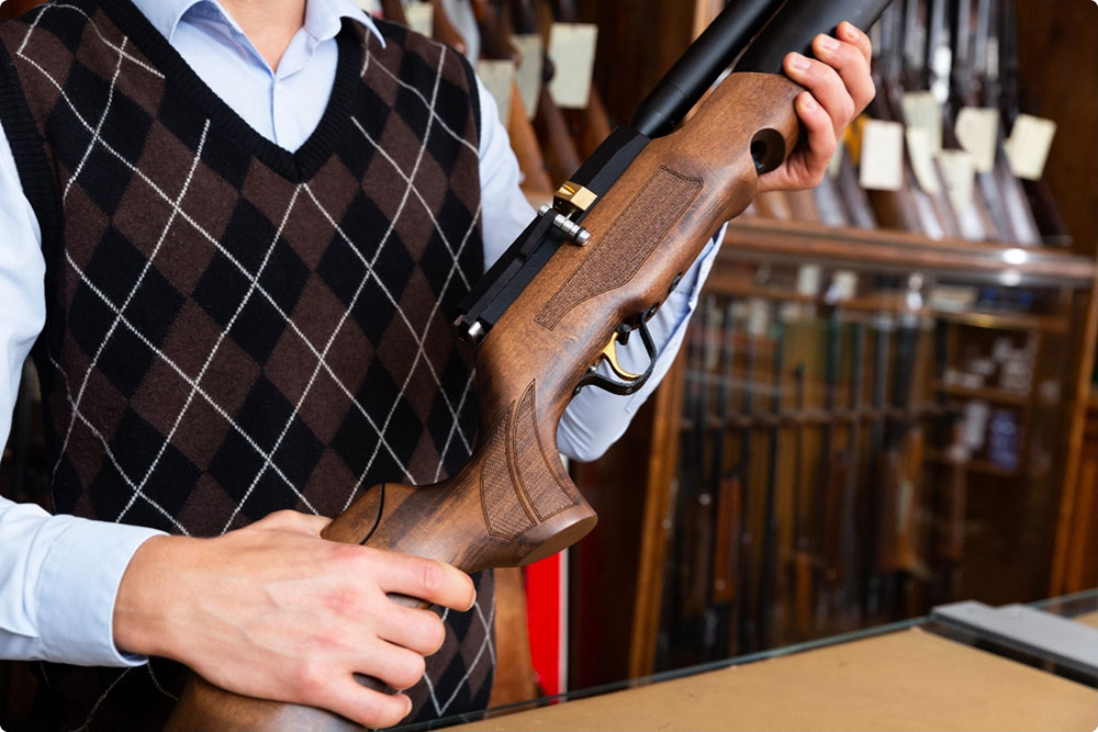 Gun smith holding gun